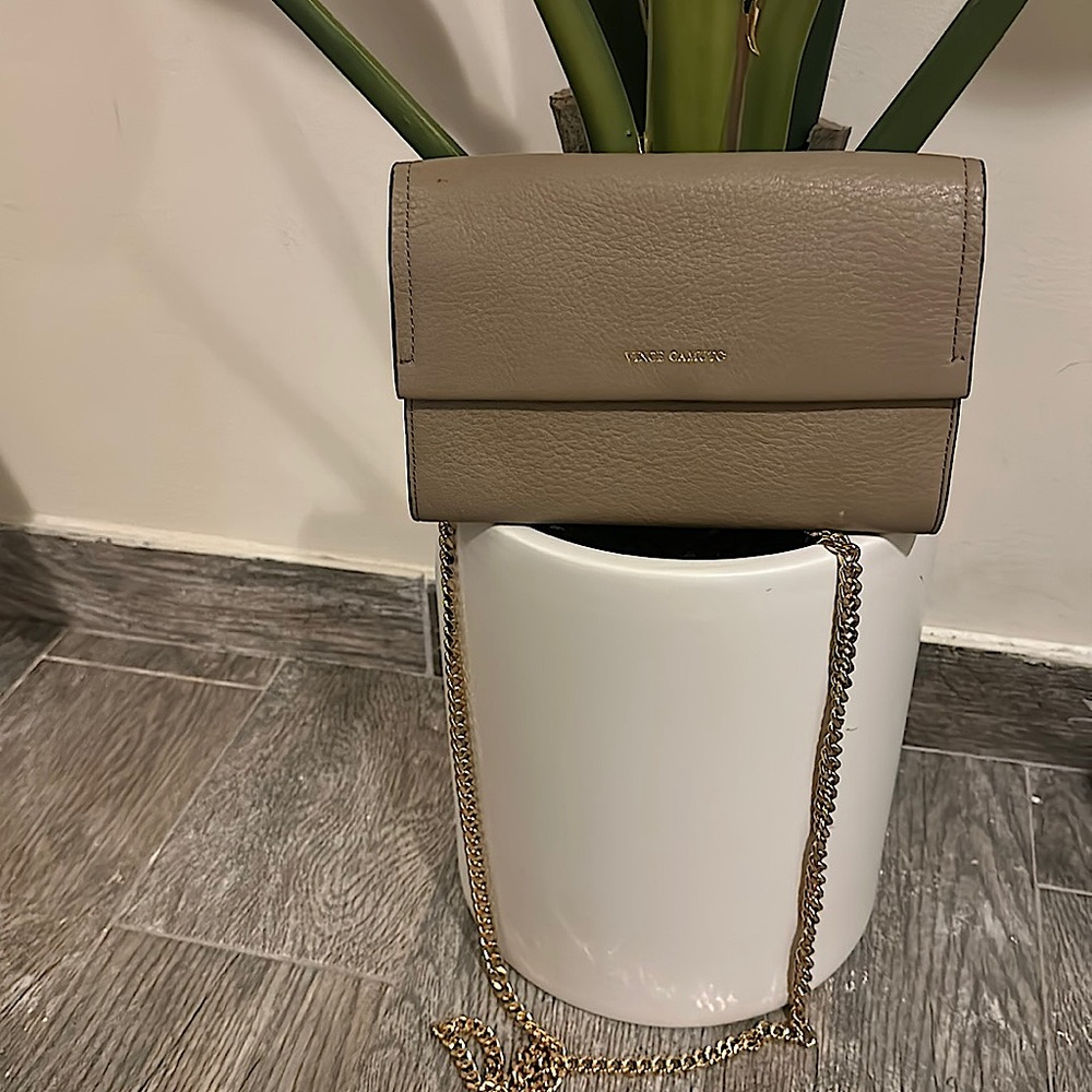 Vince camuto wallet or you can purchase a metal strap from amazon